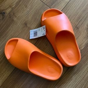 orange yeezy slides